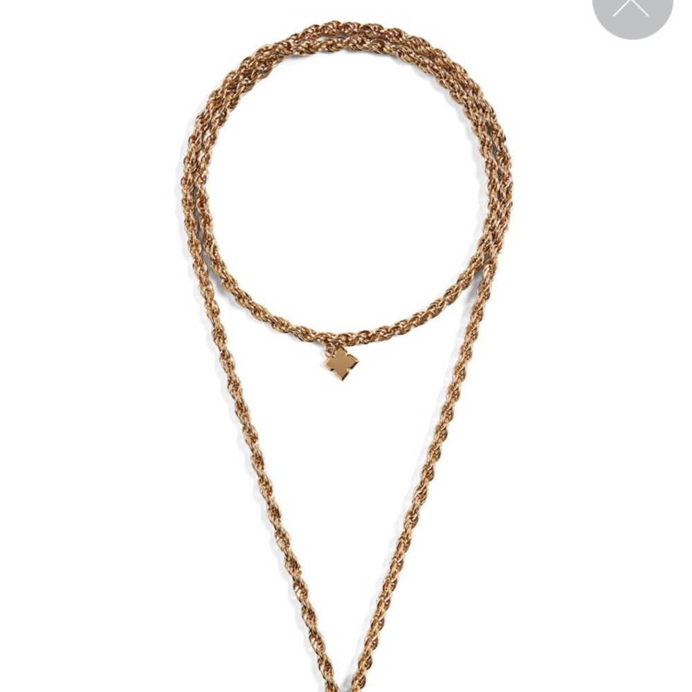 This sophisticated, braided-chain tassel necklace